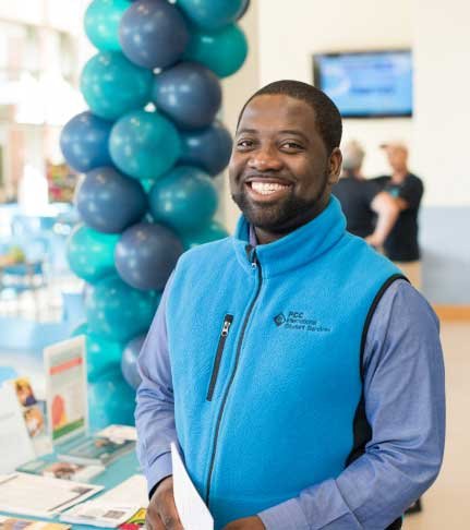 smiling man in a PCC thermal vest