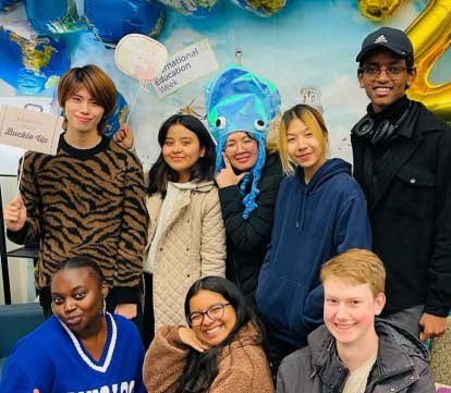 a multiethnic group of students smiling